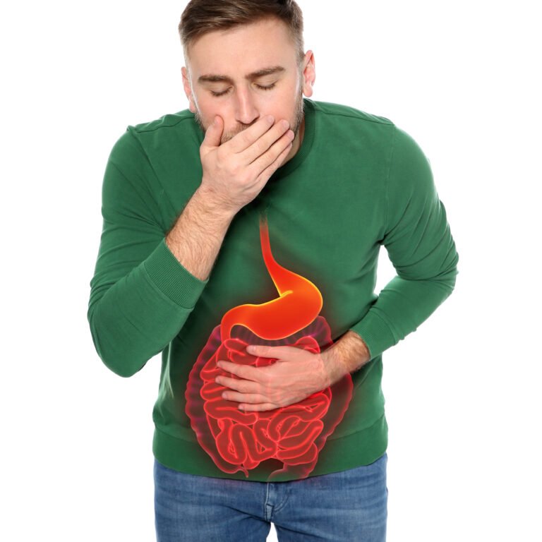 Young man suffering from stomach pain and nausea isolated on white